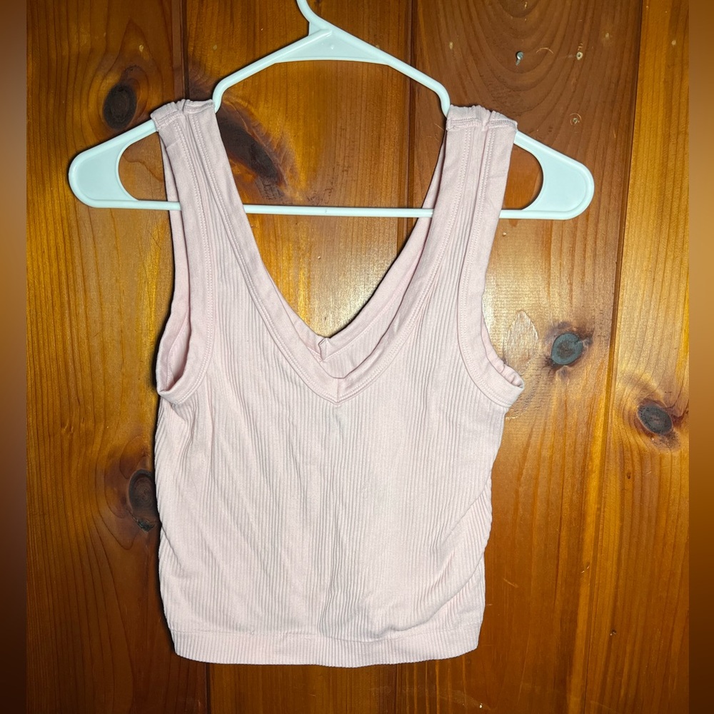 This light pink tank top is new and it’s a large.